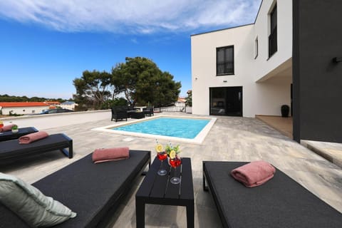Property building, Patio, Communal lounge/ TV room, Day, Natural landscape, View (from property/room), Living room, Seating area, Evening entertainment, Pool view, Swimming pool, sunbed