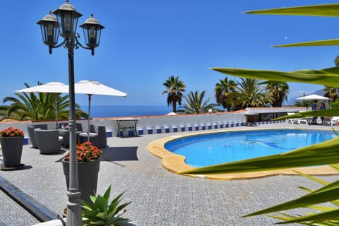 Property building, Living room, Swimming pool