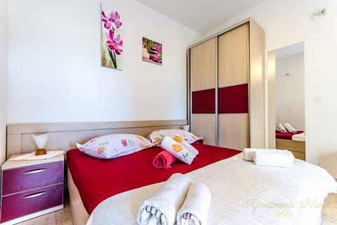 Property logo or sign, Living room, Seating area, Bedroom, Family