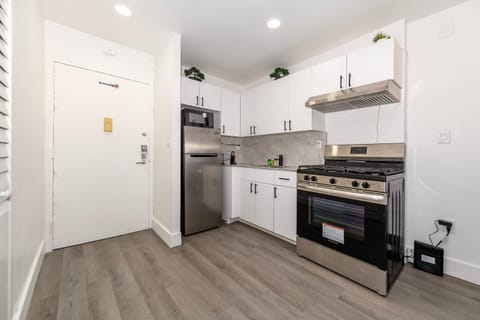 Kitchen or kitchenette, dishwasher, oven, stove