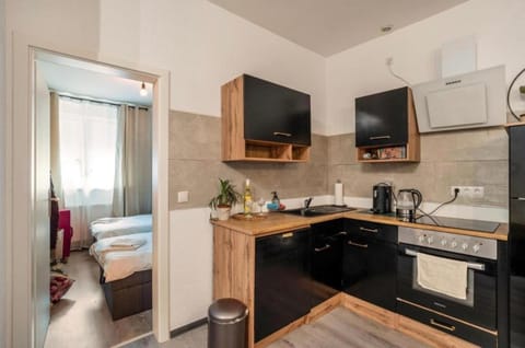 Kitchen or kitchenette, dishwasher, oven, stove