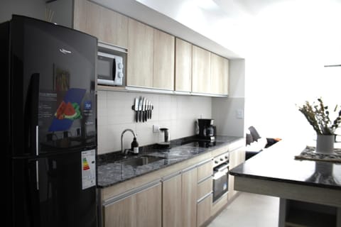 Kitchen or kitchenette, microwave, oven, stove