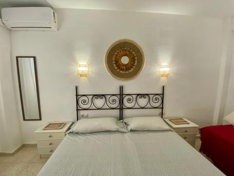 Bed, towels, wardrobe