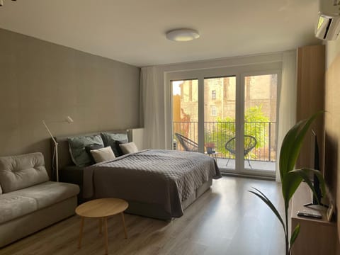 Bed, Living room, Seating area, Bedroom
