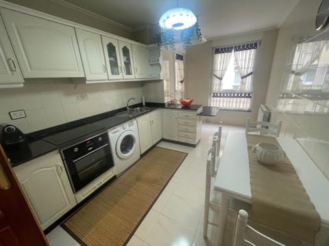 Kitchen or kitchenette, dishwasher, oven, stove, toaster, washing machine