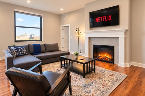 TV and multimedia, Living room, Seating area, City view, fireplace