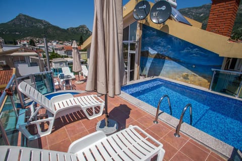 Patio, Staff, Day, People, Summer, Balcony/Terrace, Other, Decorative detail, On site, Garden view, Mountain view, Pool view, Street view, Swimming pool, Swimming pool, Family