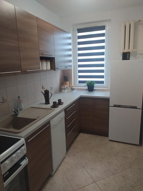 Kitchen or kitchenette, dishwasher, oven, stove