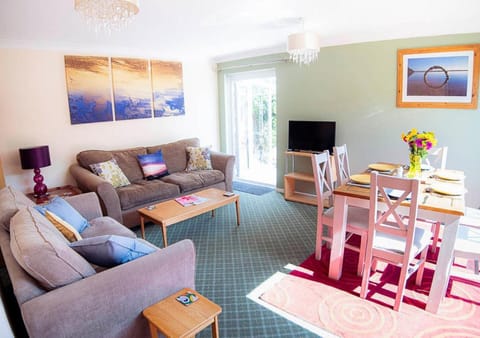 Property building, TV and multimedia, Living room, Seating area, Dining area