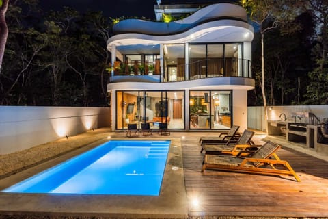 Property building, Patio, Night, Pool view, Swimming pool, sunbed
