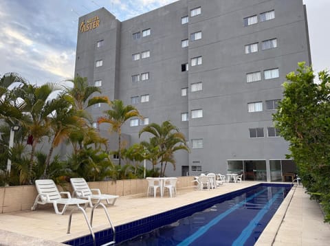 Property building, Day, Pool view, Swimming pool, sunbed