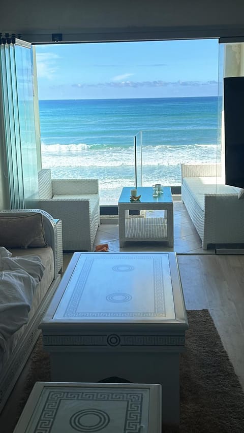View (from property/room), Balcony/Terrace, Living room, Seating area, Beach, Evening entertainment, Sea view