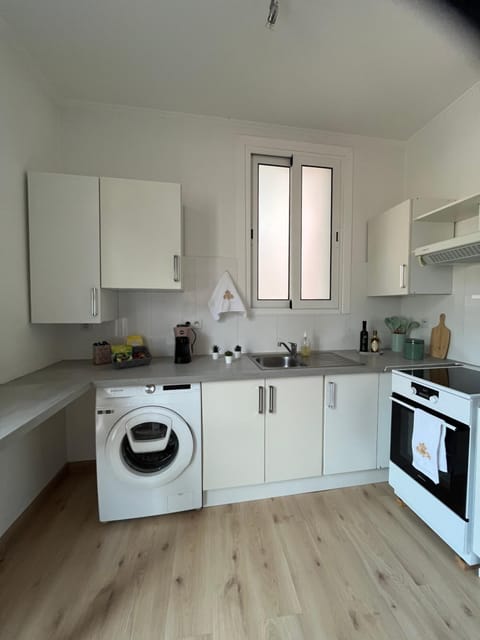 Kitchen or kitchenette, oven, stove, toaster, washing machine