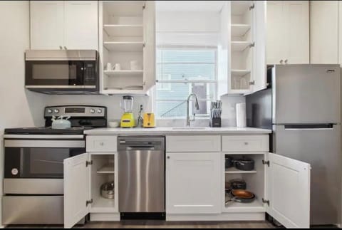 Kitchen or kitchenette, dishwasher, oven, stove, toaster