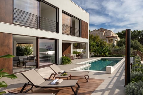 Property building, Patio, Day, Natural landscape, Pool view, Swimming pool