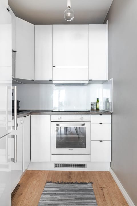Kitchen or kitchenette, dishwasher, oven, stove
