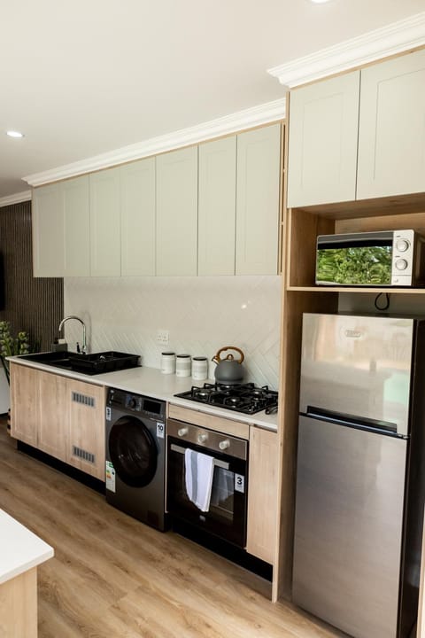 Kitchen or kitchenette, microwave, oven, stove