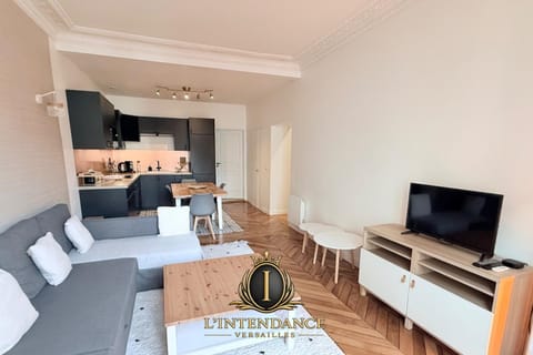 Property building, Communal lounge/ TV room, Property logo or sign, TV and multimedia, Kitchen or kitchenette, Living room, Dining area, Text overlay