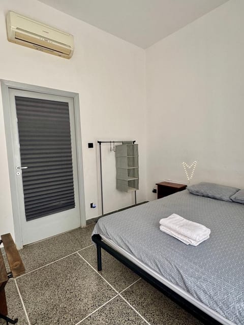 Bed, Photo of the whole room, Bedroom, towels, air conditioner