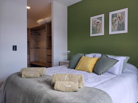 Bed, towels, wardrobe