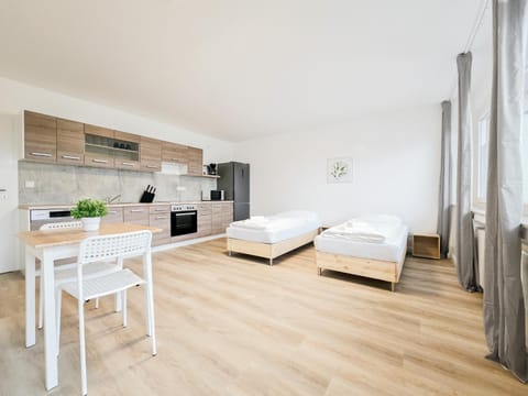 Bed, Photo of the whole room, Bedroom, dishwasher, microwave, oven, stove, towels, kitchen
