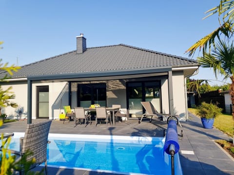 Property building, Living room, Swimming pool