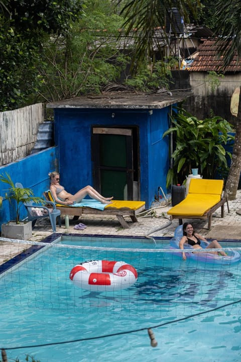 Swimming pool, group of guests, sunbed