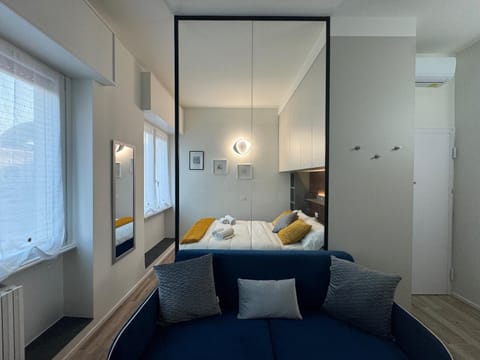 Bed, Living room, Seating area, Bedroom