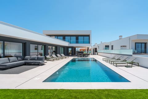 Property building, Patio, Day, Seating area, Pool view, Swimming pool, sunbed