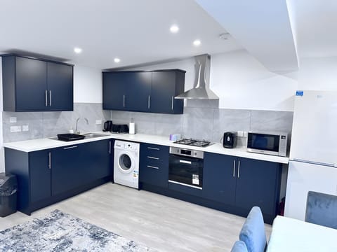 Kitchen or kitchenette, dishwasher, minibar, oven, stove, toaster, washing machine, dryer