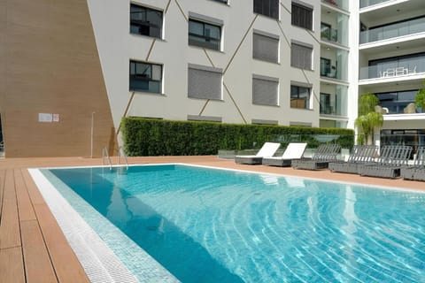 Property building, Patio, Day, Pool view, Swimming pool, sunbed