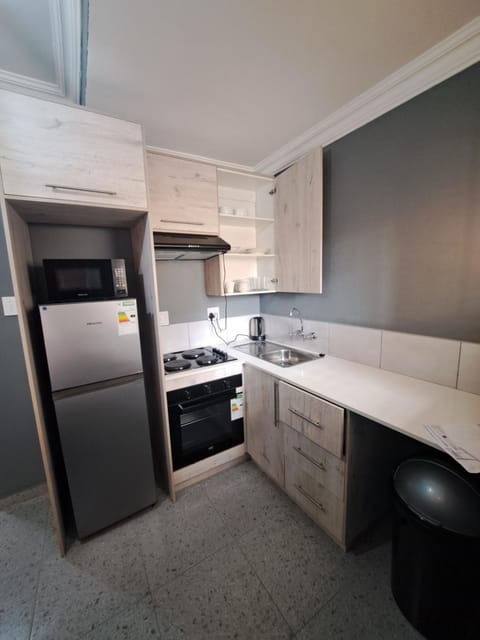 Kitchen or kitchenette, oven, stove