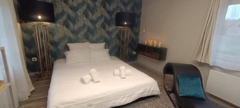 Bed, Bedroom, fireplace, towels