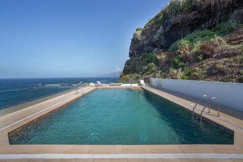 Property building, Living room, Swimming pool