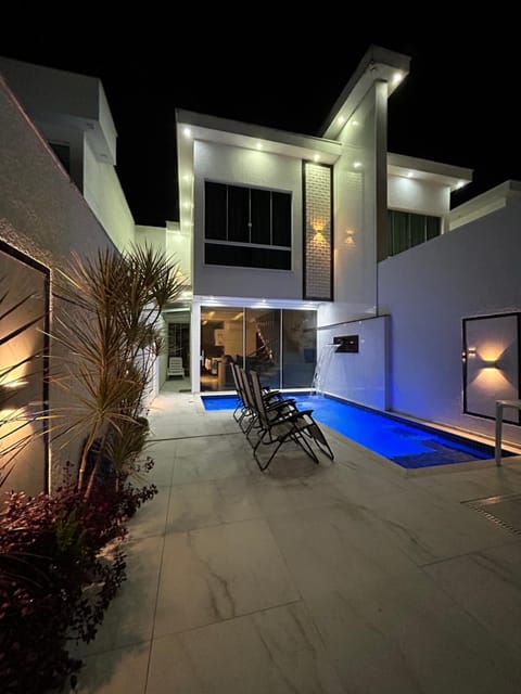 Property building, Patio, Night, Pool view, Swimming pool, sunbed