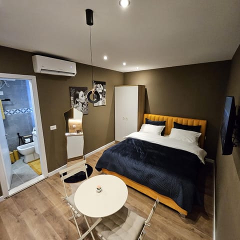 Bed, Living room, Seating area, Bedroom, wardrobe, air conditioner