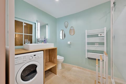 Shower, Toilet, Bathroom, towels, washing machine, dryer