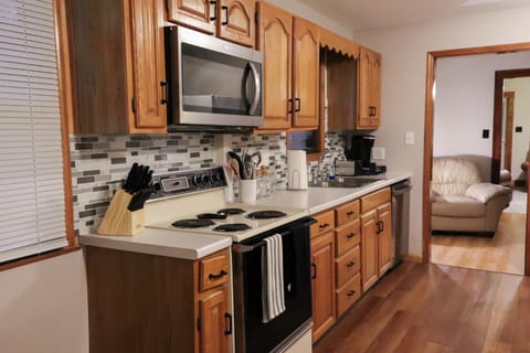 Kitchen or kitchenette, microwave, oven, stove