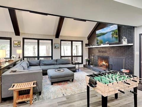 TV and multimedia, Living room, Seating area, Lake view, fireplace, furniture