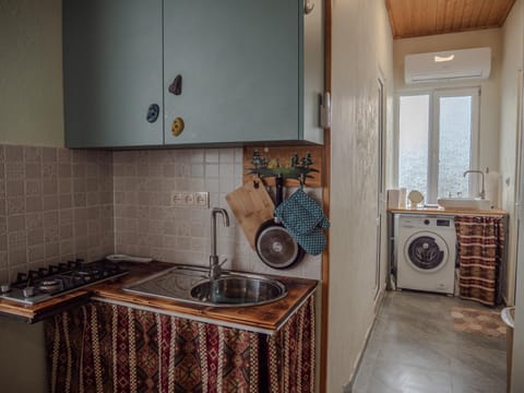 Kitchen or kitchenette, dishwasher, stove, washing machine, dryer