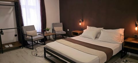 Bed, Living room, Seating area, Bedroom