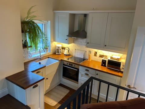 Kitchen or kitchenette, dishwasher, oven, stove, toaster