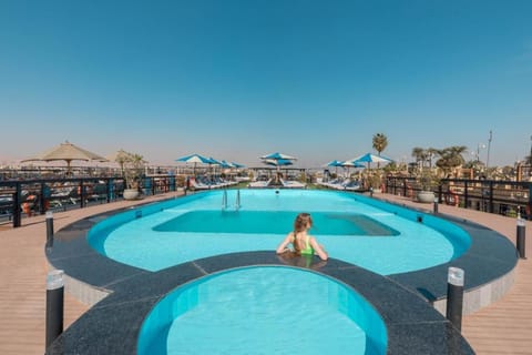 Nearby landmark, Day, Natural landscape, Pool view, Swimming pool, Swimming pool, group of guests, sunbed