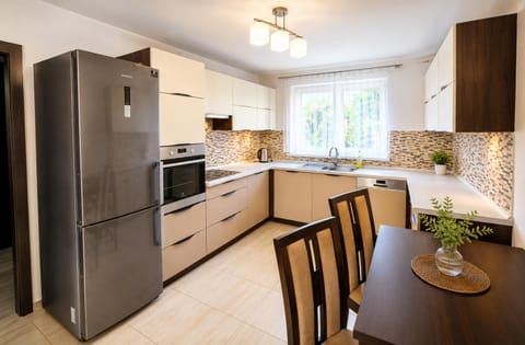 Kitchen or kitchenette, microwave, oven, stove, washing machine, kitchen