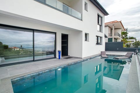 Property building, Living room, Swimming pool