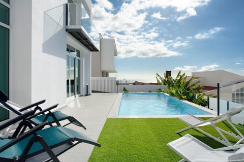 Property building, Living room, Swimming pool