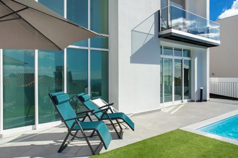 Property building, Living room, Swimming pool