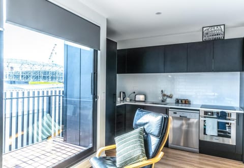 Kitchen or kitchenette, dishwasher, oven, stove, toaster