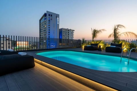 Property building, Night, Seating area, Pool view, Swimming pool, Swimming pool, sunbed, towels