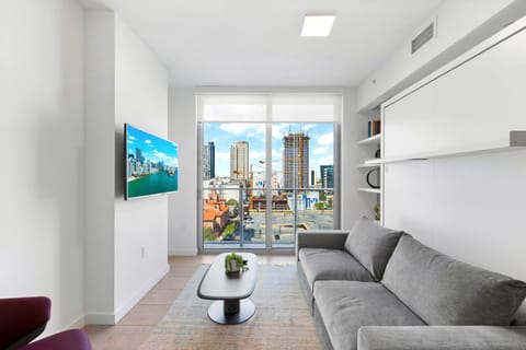 TV and multimedia, Living room, Seating area, City view, air conditioner
